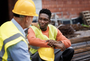 Construction workers discussing on site.